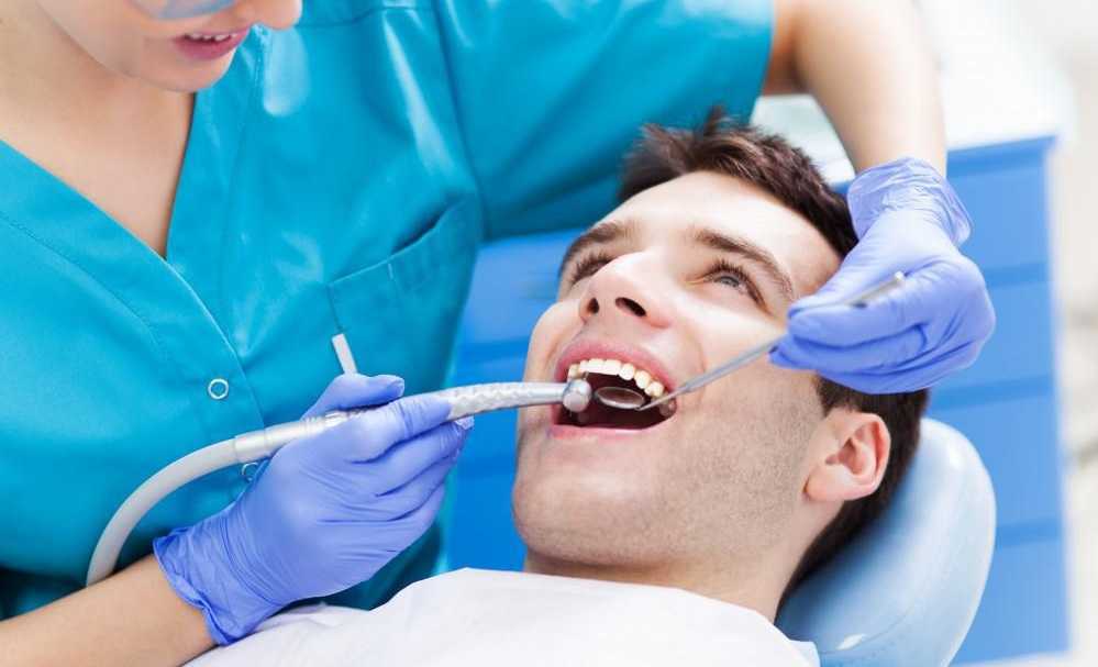 Dental Tools and Smiling Patient